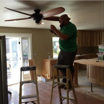 Schultz Electric - a man working on a ceiling fan - General Contractors Near Me - Hesperia, California Schultz Electric - a man working on a ceiling fan - General Contractors Near Me - Hesperia, California