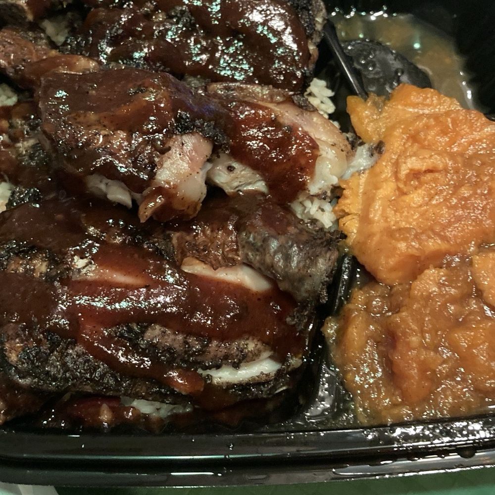 Traphouse Caribbean - Jerk Chicken plate sweet potatoes and greens - Caribbean Near Me - Austin, Texas Traphouse Caribbean - Jerk Chicken plate sweet potatoes and greens - Caribbean Near Me - Austin, Texas