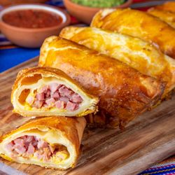 Fuego Empanadas - Ham and Swiss Empanada. Ham, swiss, mustard mayo sauce. Fuego Salsa recommended.