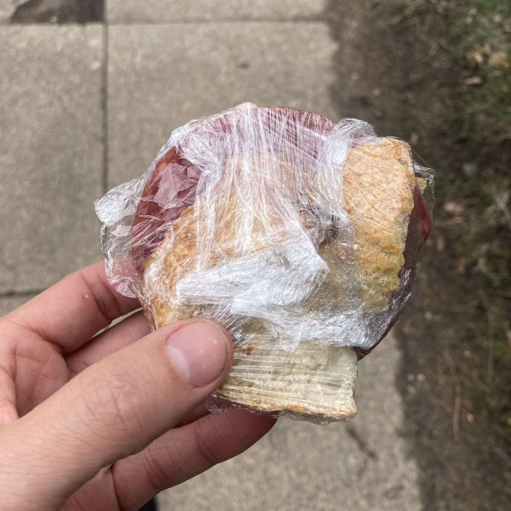 Nokomis Beach Coffee - a person holding a sandwich wrapped in plastic - Coffee & Tea Near Me - Minneapolis, Minnesota Nokomis Beach Coffee - a person holding a sandwich wrapped in plastic - Coffee & Tea Near Me - Minneapolis, Minnesota