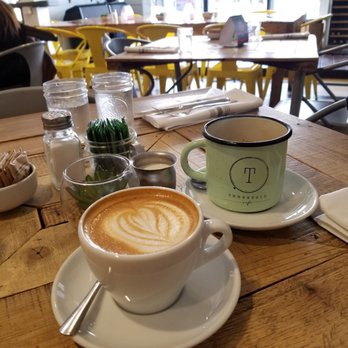 Threefold Cafe - You can see the outside tables n chairs looking past the delicious drinks - Breakfast & Brunch Near Me - Coral Gables, Florida Threefold Cafe - You can see the outside tables n chairs looking past the delicious drinks - Breakfast & Brunch Near Me - Coral Gables, Florida