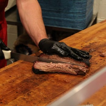 Franklin Barbecue - Slicing the brisket - Barbeque Near Me - Austin, Texas