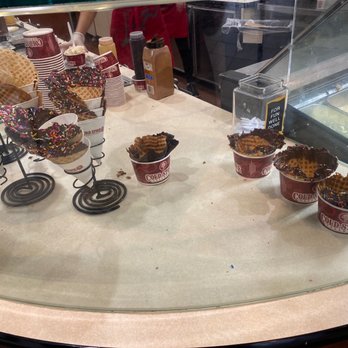 Cold Stone Creamery - a display of ice cream cones - Ice Cream & Frozen Yogurt Near Me - Fort Wayne, Indiana