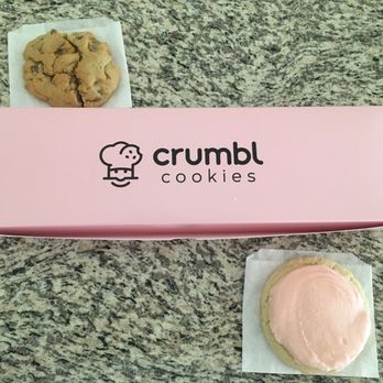 Crumbl - Red Mountain - Pretty pink box with a chocolate chip and sugar cookie beside it. - Desserts Near Me - Mesa, Arizona Crumbl - Red Mountain - Pretty pink box with a chocolate chip and sugar cookie beside it. - Desserts Near Me - Mesa, Arizona