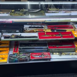 Payless Cigarette Smoke & Vape Shop - Big knife and sword