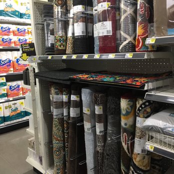 Dollar General - a variety of carpet rolls in a store - Grocery Near Me - Monroe, Oregon