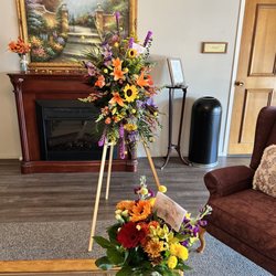 Village Flowers & Gifts - Fall colors sympathy standing spray.