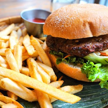 Meekong Bar - Meekong Banh Mi Burger: house-made beef patty, lettuce, tomato, cucumber, pickled vegetables, cilantro, and sriracha aioli ($15). - Vietnamese Near Me - Seattle, Washington Meekong Bar - Meekong Banh Mi Burger: house-made beef patty, lettuce, tomato, cucumber, pickled vegetables, cilantro, and sriracha aioli ($15). - Vietnamese Near Me - Seattle, Washington