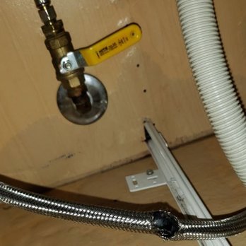 JW Home Care - Burst dishwasher hose under kitchen sink, after standing water removed - Damage Restoration Near Me - Oxnard, California