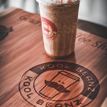 Kool Beanz - a coffee drink on a wooden table - Cafes Near Me - Rainbow City, Alabama Kool Beanz - a coffee drink on a wooden table - Cafes Near Me - Rainbow City, Alabama