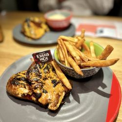 Nando's Peri-Peri - Two 1/4 Chicken Legs with Chips (aka fries)