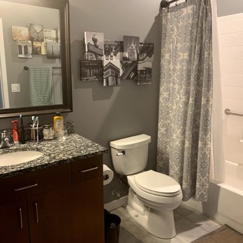 Vrapi Construction - a bathroom with a sink, toilet, and shower - General Contractors Near Me