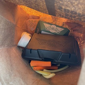 Wingstop - the inside of a paper bag filled with food - Chicken Wings Near Me - Garden Grove, California Wingstop - the inside of a paper bag filled with food - Chicken Wings Near Me - Garden Grove, California