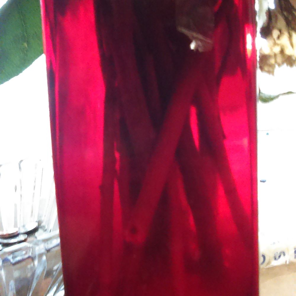 Tape on the vase that could have been removed or cut short. Instead it just makes the vase seem even tackier than it already is Tape on the vase that could have been removed or cut short. Instead it just makes the vase seem even tackier than it already is