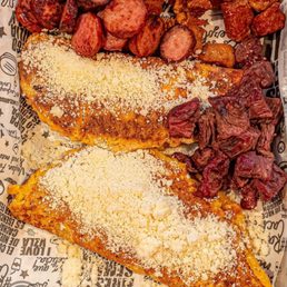 a tray of food with meat and cheese