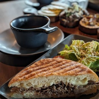 Postino Addison - Italian Beef Dip with Ciabatta Bread and Romaine Salad - Wine Bars Near Me - Dallas, Texas Postino Addison - Italian Beef Dip with Ciabatta Bread and Romaine Salad - Wine Bars Near Me - Dallas, Texas