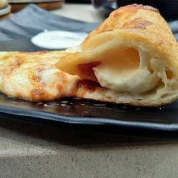 Zio Als Pizza And Pasta - Up close with the stuffed crust! - Pizza Near Me - Plano, Texas