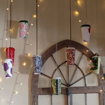 Fraise Cafe - Art display on entryway wall. - Creperies Near Me - Fullerton, California