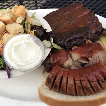 Callahan's West - Three way BBQ sampler: ribs, brisket, and sausage with two sides, side salad, plus another side not pictured. - Pubs Near Me - Lenexa, Kansas