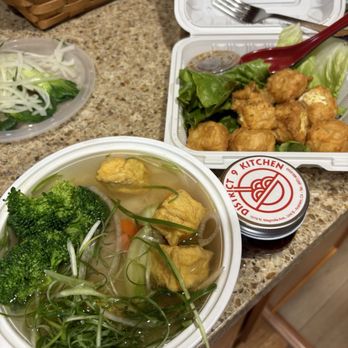 District 9 Kitchen - Veggie pho with vegan broth, mini chili oil jar, and tempura tofu - Noodles Near Me - Anaheim, California