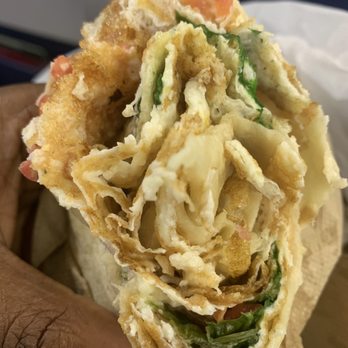 Malone's Fish Market - a hand holding a sandwich - Bars Near Me - Newark, New Jersey
