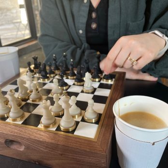 Harmony Coffee - Oat milk cappuccino. We provided our chess set. - Coffee & Tea Near Me - Minneapolis, Minnesota