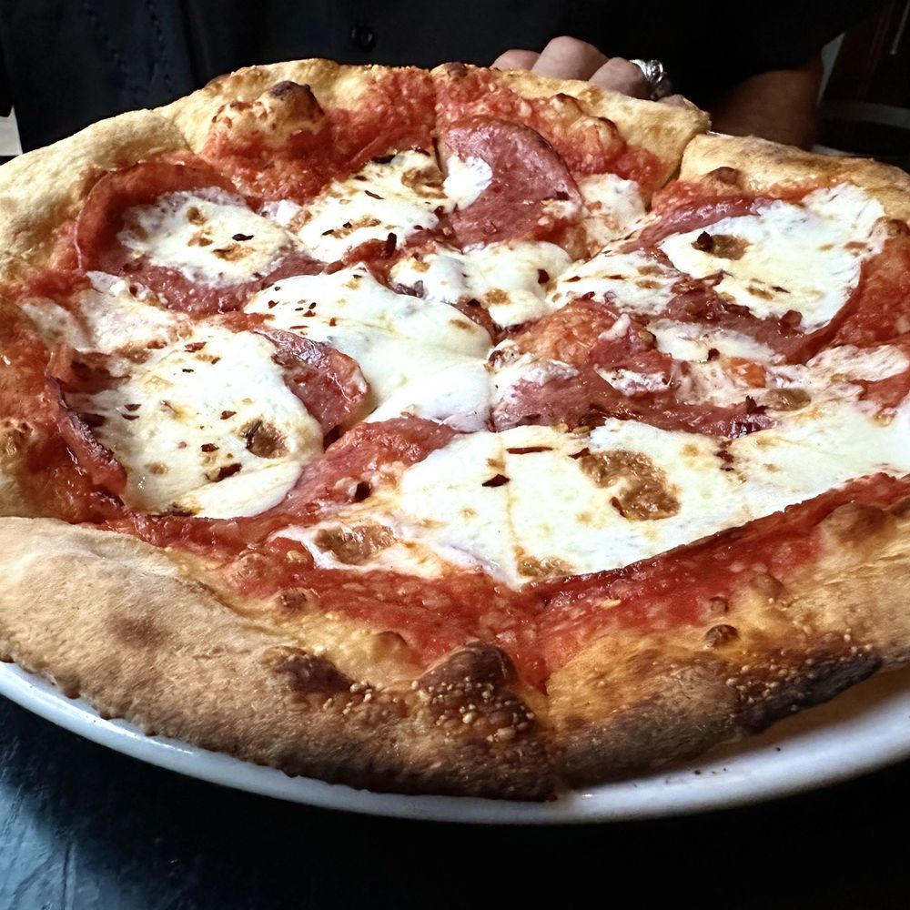 The Still Speakeasy - Essentially a salami pizza with fresh mozzarella and a spicy tomato sauce - Speakeasies Near Me - Tucson, Arizona The Still Speakeasy - Essentially a salami pizza with fresh mozzarella and a spicy tomato sauce - Speakeasies Near Me - Tucson, Arizona