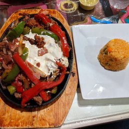 a plate of food and a plate of rice a plate of food and a plate of rice