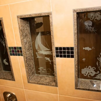 Integral Tile - a shower with three glass doors - Flooring Near Me Integral Tile - a shower with three glass doors - Flooring Near Me