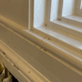 Anthony's - Dirty window, messy plate - A detailed close-up of a window frame shows dust, dirt, and grime accumulated on the painted surface. - Venues & Event Spaces Near Me - Springfield, Pennsylvania