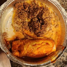 Someone, please help me figure out what this is. Mind you, there is no cheese inside enchilada. Someone, please help me figure out what this is. Mind you, there is no cheese inside enchilada.