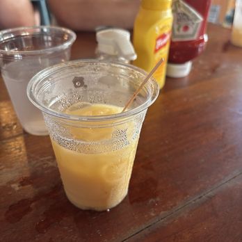 Skinny Legs Bar and Grill - Painkiller drink (try it) - Burgers Near Me - St John, Virgin Islands
