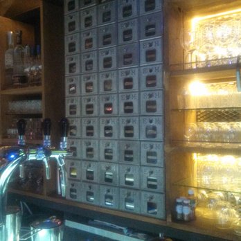 Cotidiana - their wall of little cubby-holes of neat things - Cocktail Bars Near Me - Ciudad de México, DIF