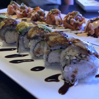 Sato Sushi - The roll in front was with Eel and Avocado thinly sliced on top. The center was completely filled with imitation crab. - Japanese Near Me - Upland, California Sato Sushi - The roll in front was with Eel and Avocado thinly sliced on top. The center was completely filled with imitation crab. - Japanese Near Me - Upland, California