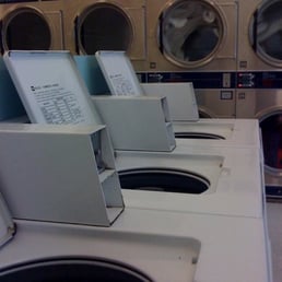 Rows of empty, clean washing machines Rows of empty, clean washing machines