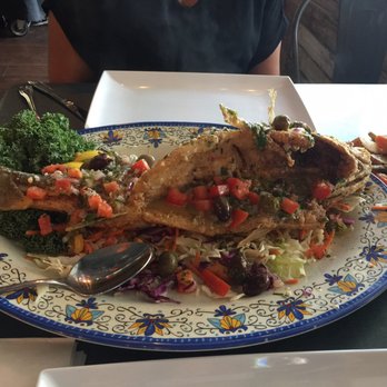 Tin Fish - Bronzini with Mediterranean sauce - New American Near Me - Sunrise, Florida Tin Fish - Bronzini with Mediterranean sauce - New American Near Me - Sunrise, Florida
