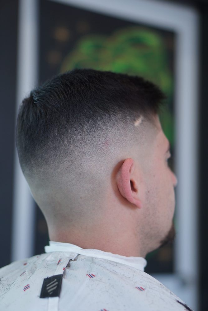 Overgrown courtesy of Kith N Kin barbershop Logo