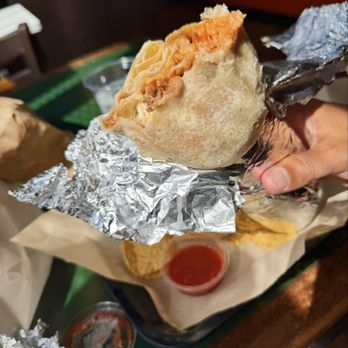 El Faro - Enjoying a super pork burrito - Mexican Near Me - San Francisco, California El Faro - Enjoying a super pork burrito - Mexican Near Me - San Francisco, California