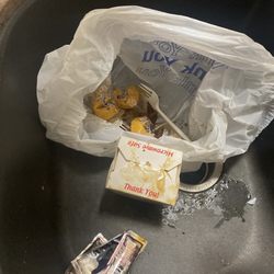 Spilled beef and broccoli in bag with rice box