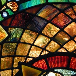 Tiffany Stained Glass - Design services for custom stained and beveled glass windows and doors. Restoration services and rewiring repairs for all lamp types.