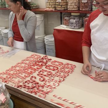 Logan's Candies - Shaping the delicious candy canes - Candy Stores Near Me - Ontario, California Logan's Candies - Shaping the delicious candy canes - Candy Stores Near Me - Ontario, California