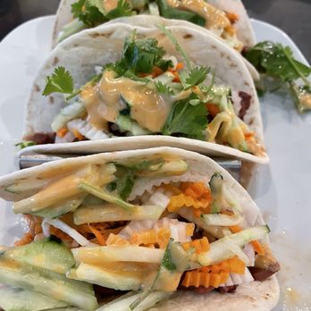 4 Guys Bistro - Vietnamese tacos with pork, pickled vegetables & sauce with a little kick. - Asian Fusion Near Me - Topeka, Kansas 4 Guys Bistro - Vietnamese tacos with pork, pickled vegetables & sauce with a little kick. - Asian Fusion Near Me - Topeka, Kansas
