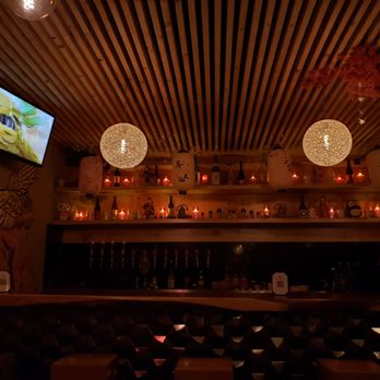 Origami Sake Bar - a bar with candles and a television - Speakeasies Near Me - El Paso, Texas