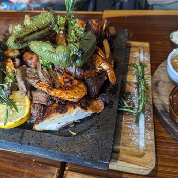 El Jefe Lena Y Mar - A tower of grilled meats and veggies flamed tableside accompanied by rice, beans, corn and tortillas to share - Seafood Near Me - Aurora, Illinois El Jefe Lena Y Mar - A tower of grilled meats and veggies flamed tableside accompanied by rice, beans, corn and tortillas to share - Seafood Near Me - Aurora, Illinois