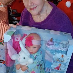 Senior Oaks - Nina got her baby doll for Christmas. She won't keep the clothes on it, but we still have it. She sleeps with it every day.