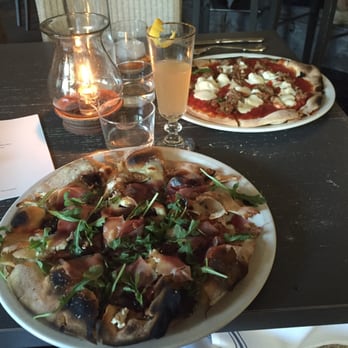 Tiny Boxwoods - The tasty Brie, fig, cherry and spinach wood fired pizza! Along side is the same wood fired pizza with sausage and mozzarella!! - New American Near Me - Houston, Texas Tiny Boxwoods - The tasty Brie, fig, cherry and spinach wood fired pizza! Along side is the same wood fired pizza with sausage and mozzarella!! - New American Near Me - Houston, Texas