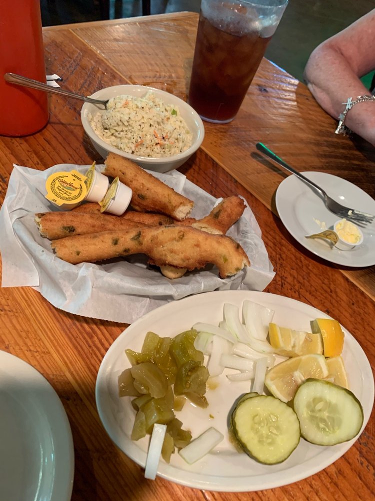 Cold slaw, a relish plate, and huge jalapeño hush puppies come with every meal! Yelp