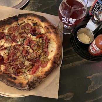 Back Unturned Brewing - Some fresh cheese to sprinkle on top! Redhead in the Hay - Raspberry Saison - Brewpubs Near Me - San Antonio, Texas