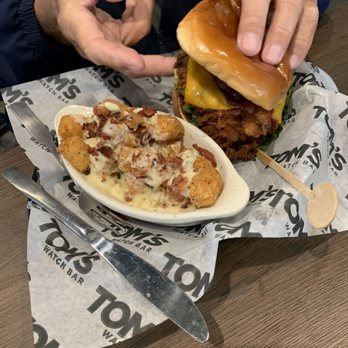 Tom's Watch Bar - Fried chicken club sandwich with loaded tots - Sports Bars Near Me - Pittsburgh, Pennsylvania Tom's Watch Bar - Fried chicken club sandwich with loaded tots - Sports Bars Near Me - Pittsburgh, Pennsylvania