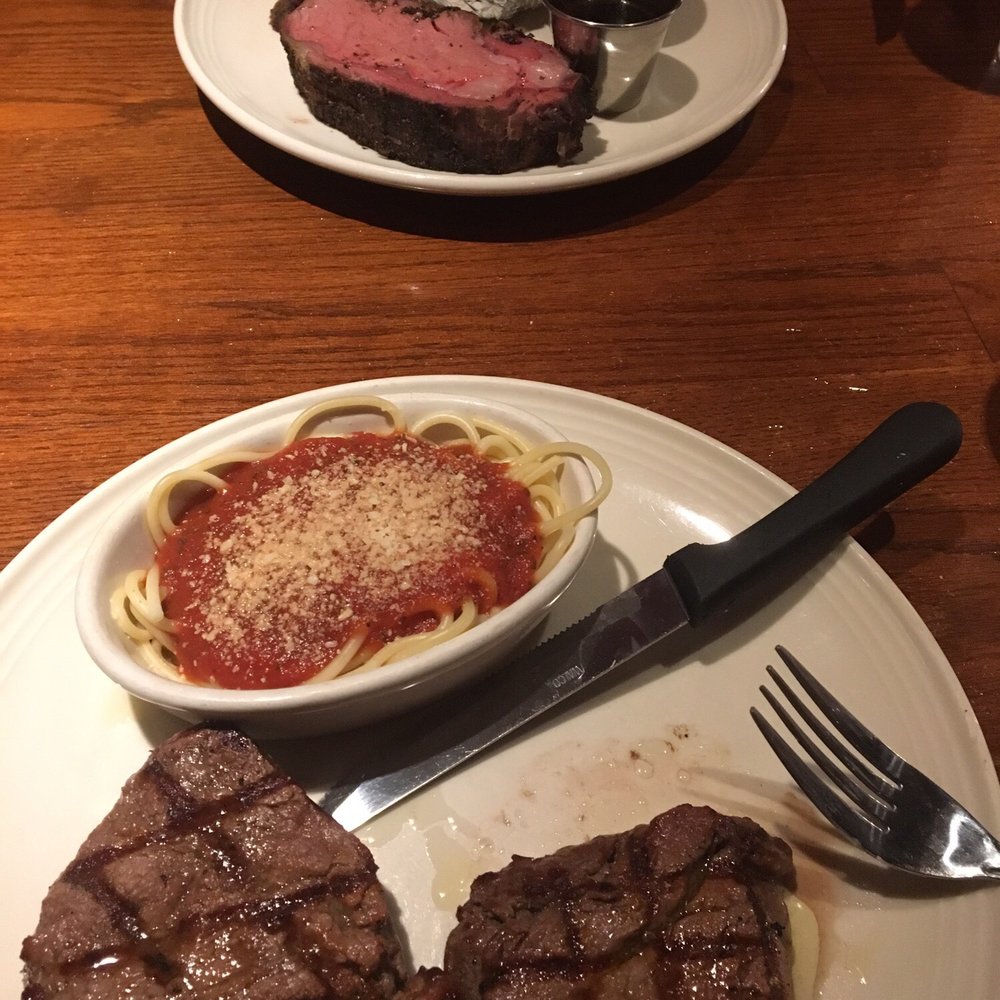 Chicago Speakeasy - Baby face prime rib with baked potato and two tenderloins with a side of spaghetti. - New American Near Me - Des Moines, Iowa